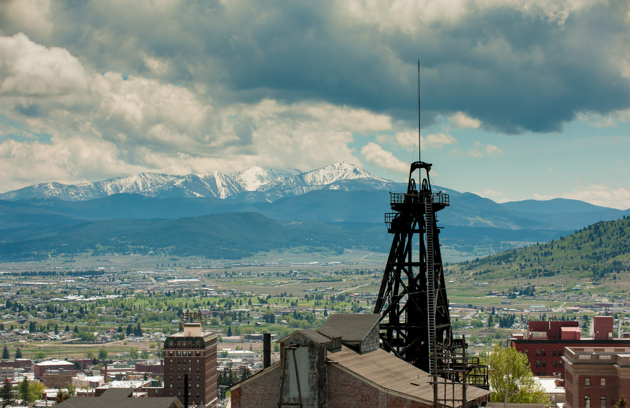 Photo of a headframe above Butte, Montana and the surrounding valley. Photo by Donnie Sexton, Department of Tourism
