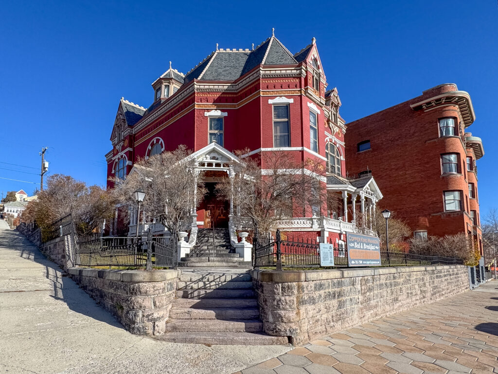 Exterior photo of the Copper King Mansion in Butte, Montana. 34 room Victorian style home with stained glass, frescoes, and antiques. Tour or stay at the Copper King Mansion.