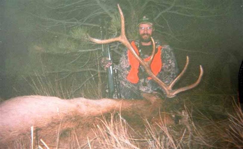 God's Country Outfitters: hunter with elk