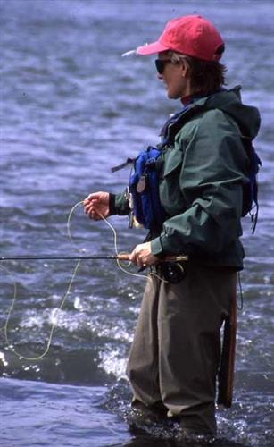 David Payne Outdoors: woman with waders fishing