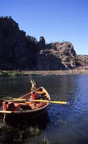 David Payne Outdoors: river boat and fisherman