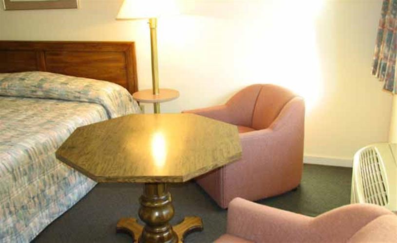 Motel 6: king bed with table